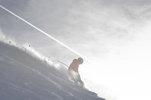 young athlete man have fun during skiing sport on hi mountain slopes at winter seasson and sunny day