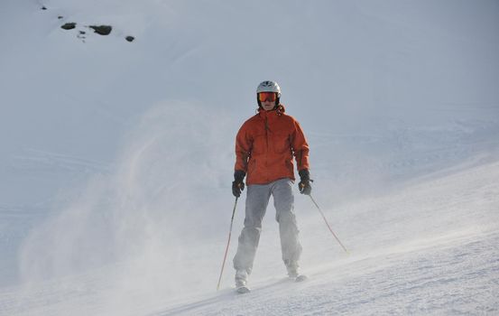 young athlete man have fun during skiing sport on hi mountain slopes at winter seasson and sunny day