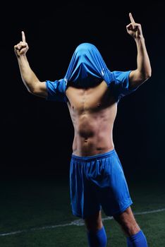 soccer player doing kick with ball on football stadium  field  isolated on black background