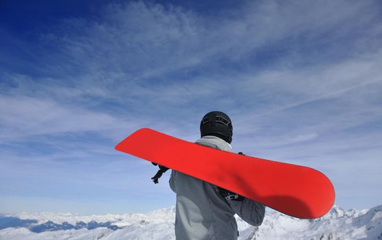 happy young man have fan while relaxing at snow with ski and snowboard sport at winter season