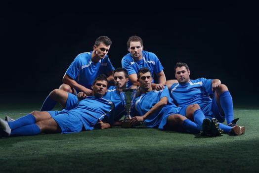 soccer players team group celebrating the victory and become champion of game while holding win coup