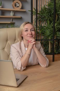 Woman sits on a chair girl vintage female white caucasian happiness relaxation. Posing feminine cheerful, furniture joyful