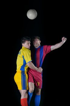 soccer player doing kick with ball on football stadium  field  isolated on black background