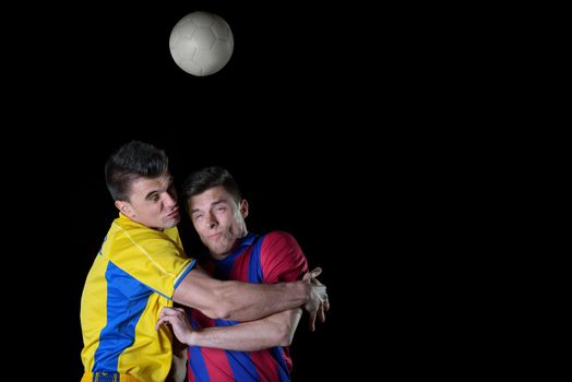 soccer player doing kick with ball on football stadium  field  isolated on black background