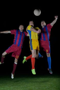 soccer player doing kick with ball on football stadium  field  isolated on black background