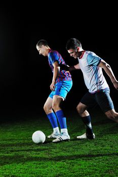 competition Action run and jump Duel of football players at soccer ball stadium at night