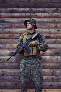 soldier portrait with  protective army tactical gear  and weapon having a break and relaxing