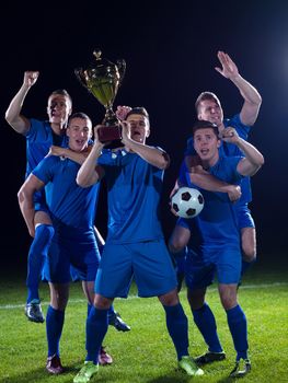 soccer players team group celebrating the victory and become champion of game while holding win coup