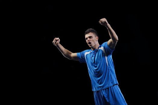 soccer player doing kick with ball on football stadium  field  isolated on black background