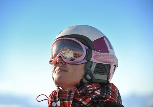 happy people group have fun on snow at winter season on mountain with blue sky and fresh air