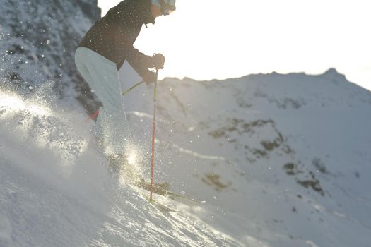 young athlete man have fun during skiing sport on hi mountain slopes at winter seasson and sunny day