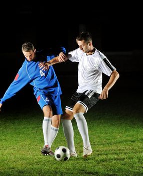 competition Action run and jump Duel of football players at soccer ball stadium at night