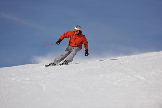 young athlete man have fun during skiing sport on hi mountain slopes at winter seasson and sunny day