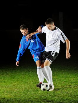 competition Action run and jump Duel of football players at soccer ball stadium at night