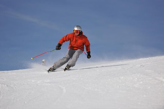 young athlete man have fun during skiing sport on hi mountain slopes at winter seasson and sunny day