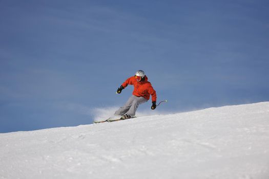 young athlete man have fun during skiing sport on hi mountain slopes at winter seasson and sunny day