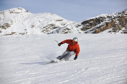 young athlete man have fun during skiing sport on hi mountain slopes at winter seasson and sunny day