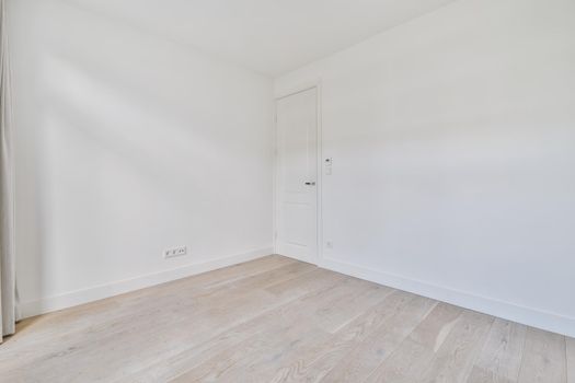 Empty room interior in daylight with parquet floor