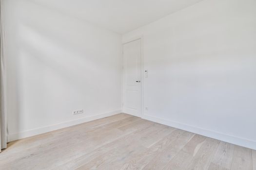 Empty room interior in daylight with parquet floor