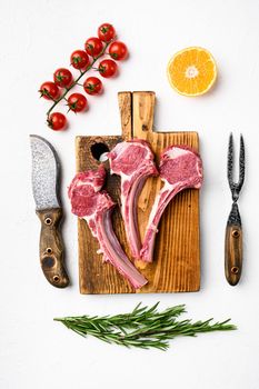 Uncooked mutton rack of lamb set, on white stone table background, top view flat lay