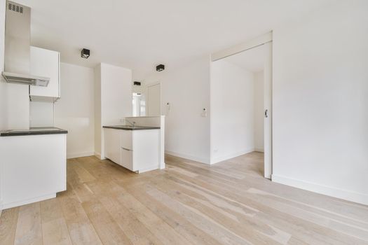 Empty room interior in daylight with parquet floor