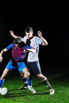 competition Action run and jump Duel of football players at soccer ball stadium at night