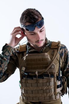 american  marine corps special operations soldier preparing tactical and commpunication gear for action battle closeup studio portrait isolated on white background