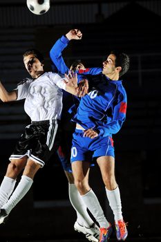 competition Action run and jump Duel of football players at soccer ball stadium at night