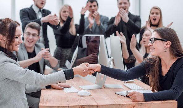 business team applauding at a work meeting . the concept of success