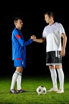 competition Action run and jump Duel of football players at soccer ball stadium at night