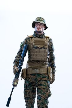 american  marine corps special operations modern warfare soldier with fire arm weapon and protective army tactical gear ready for battle