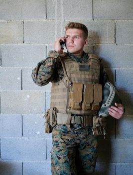 soldier using smartphone and calling home family and friends