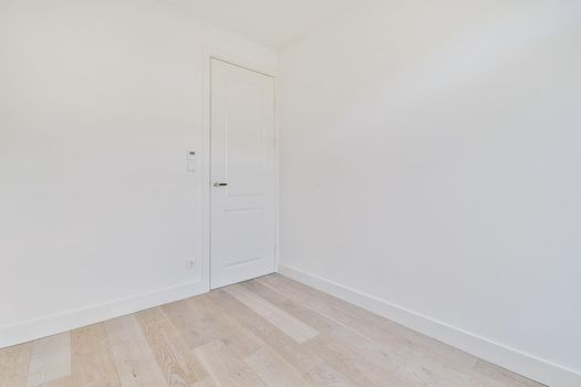 Empty room interior in daylight with parquet floor