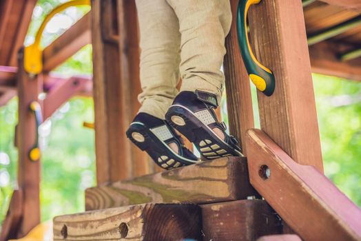 children's orthopedic shoes on the boy's feet. Thomas Heel