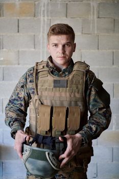 soldier preparing tactical protective and communication gear for action battle