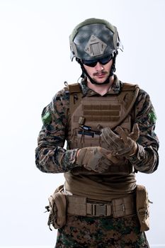 closeup of modern warfare soldier hands putting protective battle gloves white background