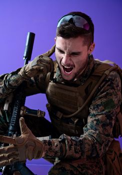 soldier preparing tactical and communication gear for action battle purple background