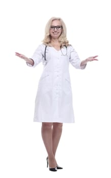 in full growth. attractive female doctor smiles and gives a thumbs up . isolated on a white