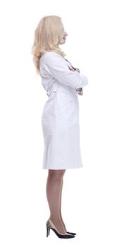 side view. female doctor reading an ad on a white screen . isolated on a white background.