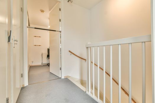 Modern room with wooden floor and white walls