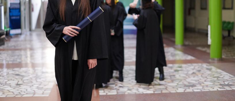 Happy woman portrait on her graduation day University. Education and people.