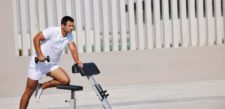 young healthy athlete man exercise at poolside