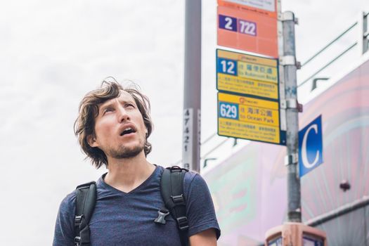 A man lost in Hong Kong. Buses in hong kong.