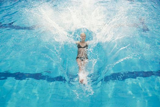 beautiful young woman relax and have fun at swimming pool 