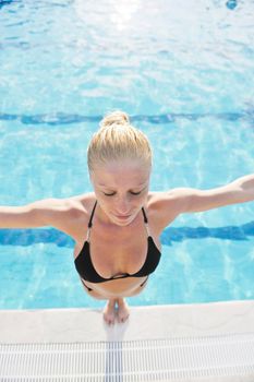 beautiful young woman relax and have fun at swimming pool