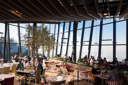 Young parents enjoying lunch time with their children at a luxury restaurant