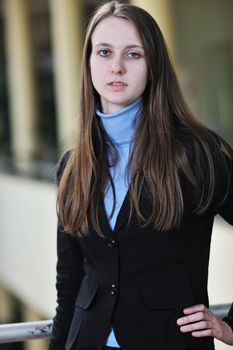 happy young student girl possing at university campus and reopresenting education concept