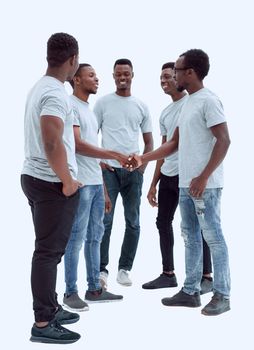 in full growth. smiling friends shaking hands. isolated on white background