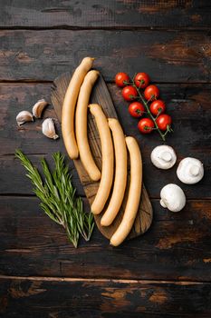 Fresh meat hot dog sausages set, on old dark wooden table background, top view flat lay, with copy space for text