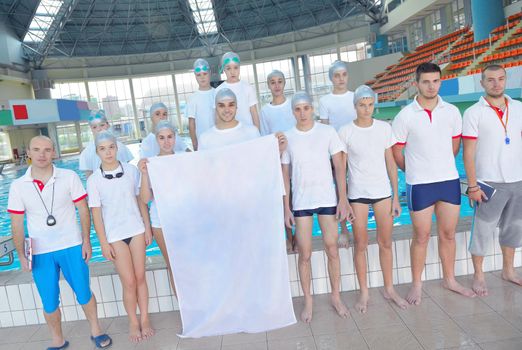 portrait group of happy kids children  at swimming pool school with empty white flag